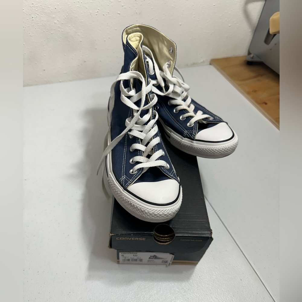 Slightly worn navy blue Converse
